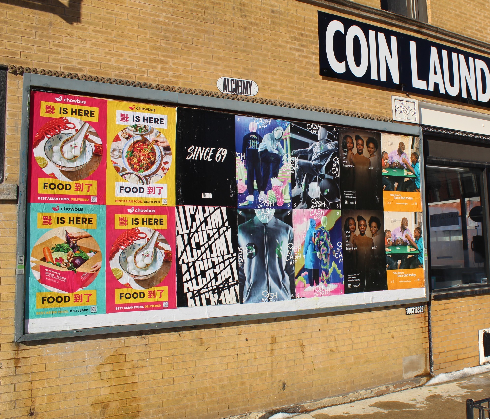 Chowbus Wild Posting® posters displayed on a Chicago storefront wall along a busy sidewalk