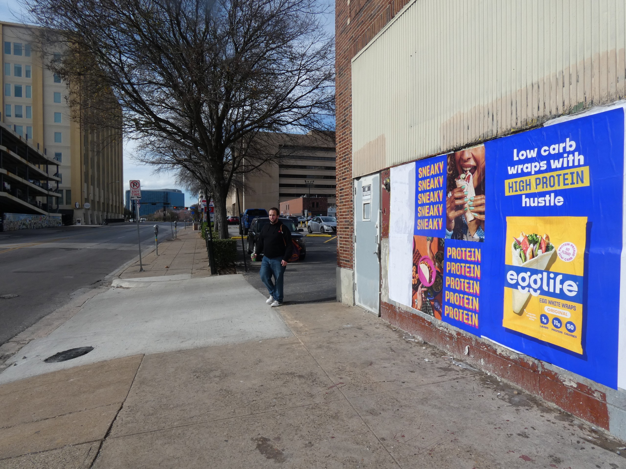 Egglife wheat pasting wild posting campaign installed on an urban street wall with high pedestrian visibility