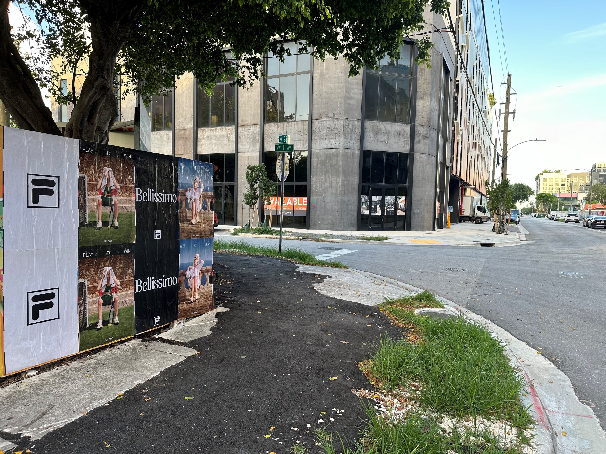FILA Bellissimo Wild Posting® campaign installed along a street corner in an urban neighborhood