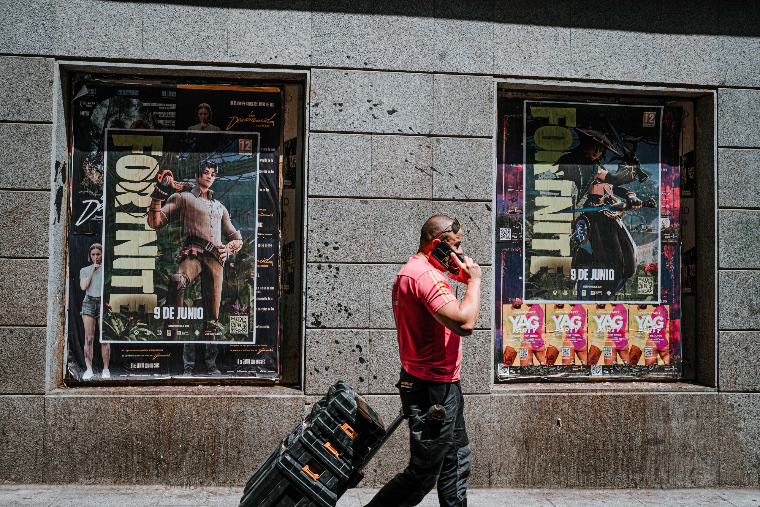 Wild Posting® Fortnite campaign featuring multiple posters installed in recessed street frames with pedestrian exposure in Madrid.