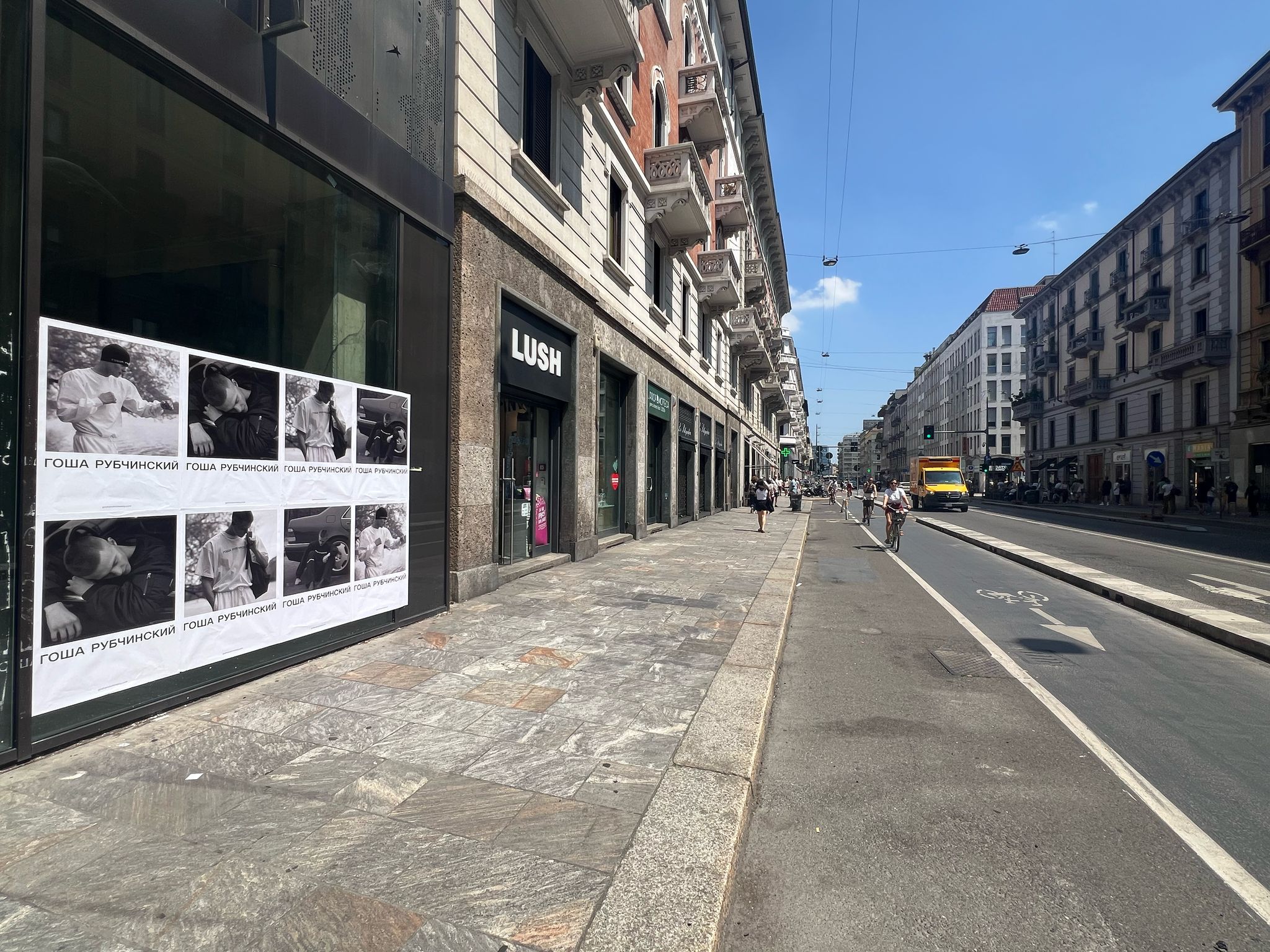 Gosha Rubchinskiy Wild Posting® campaign installed on a storefront window along a major retail street in Milan, Italy.