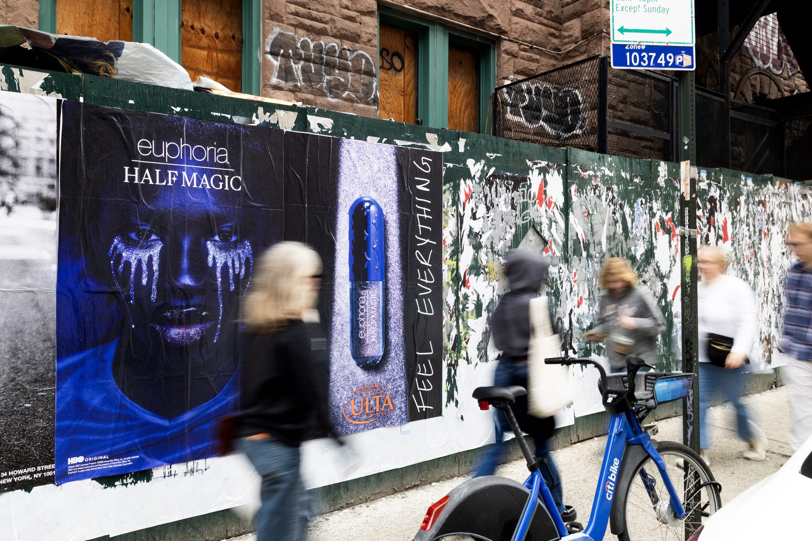 Half Magic Beauty Euphoria 'Feel Everything' Wild Posting® in New York City with pedestrians passing by
