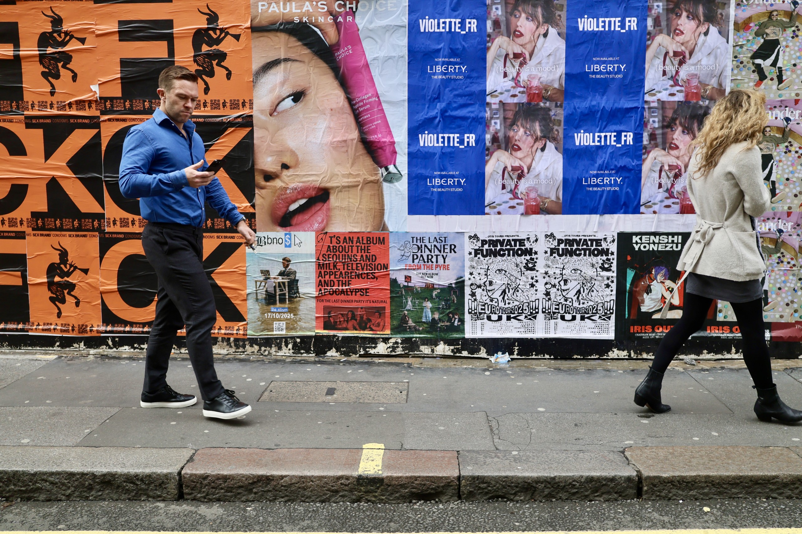 Wild Posting® street posters in London creating high-visibility pedestrian exposure across dense urban sidewalks and cultural districts.