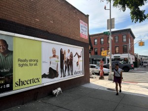Street-level Sheertex billboard featuring inclusive fashion messaging in NYC