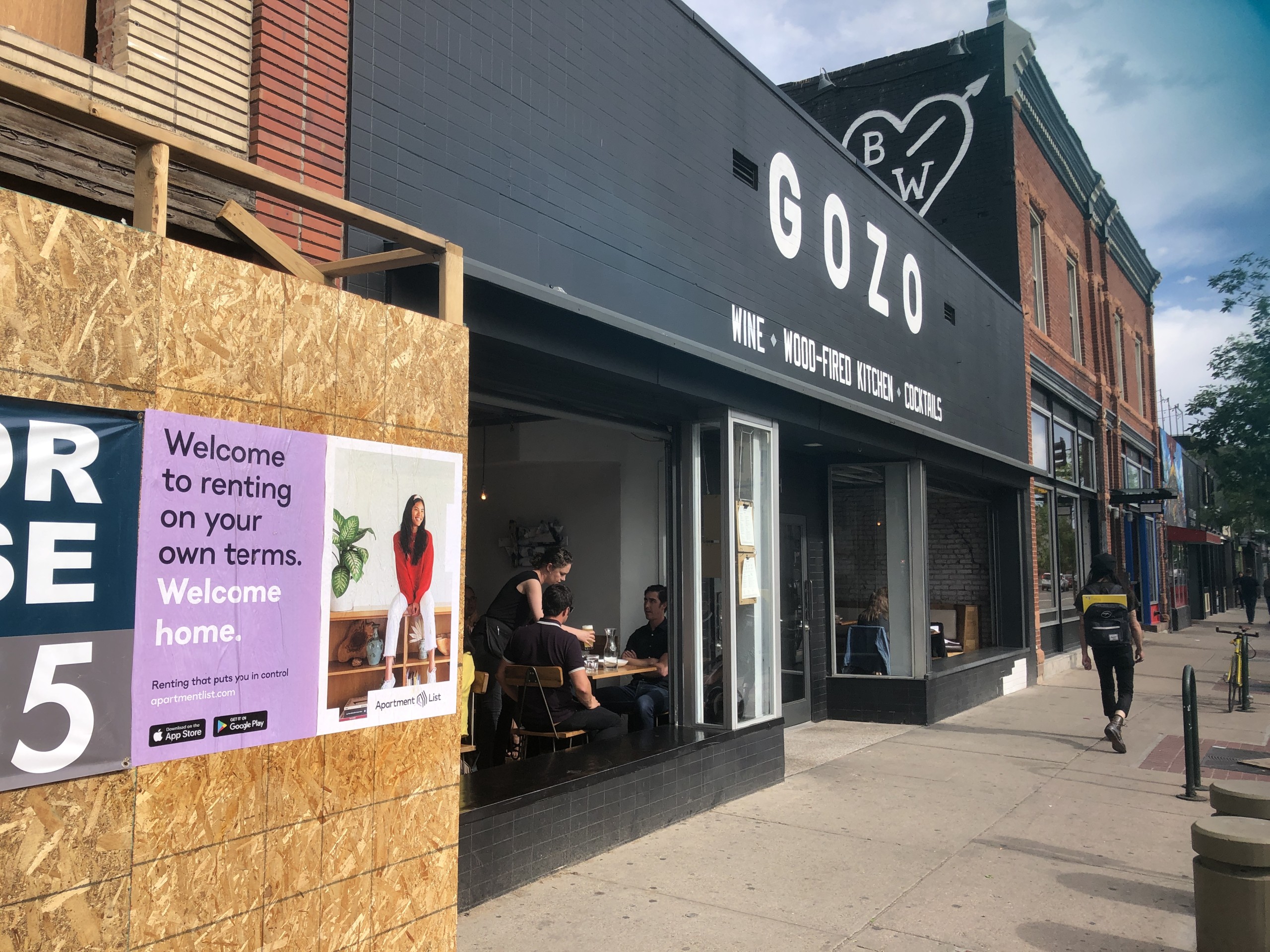 Street poster installation in Denver restaurant district.