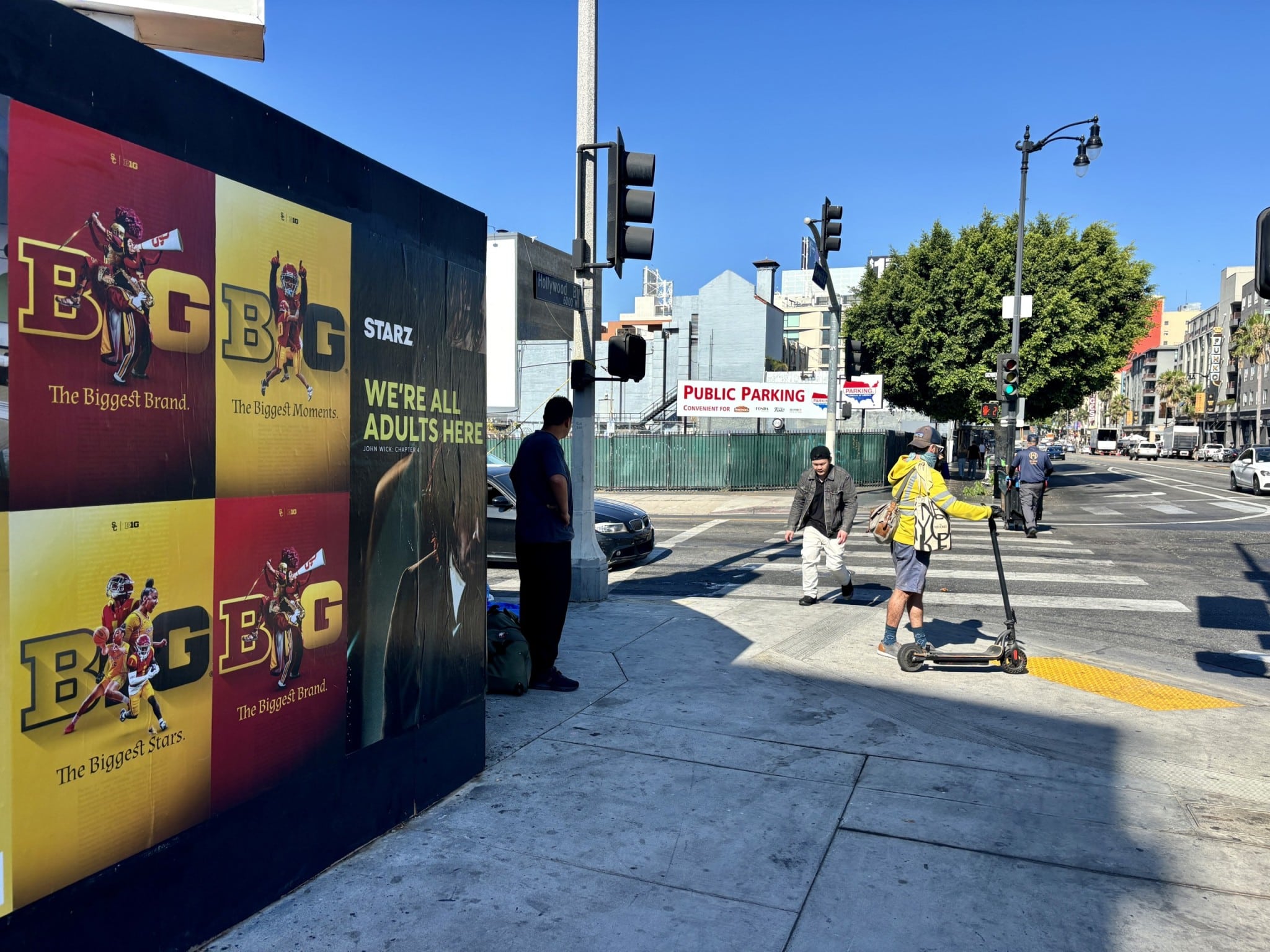 Wild Posting® street advertising installation at Hollywood Boulevard and Gower Street in Los Angeles, featuring a multi-poster grid along a high-traffic intersection.