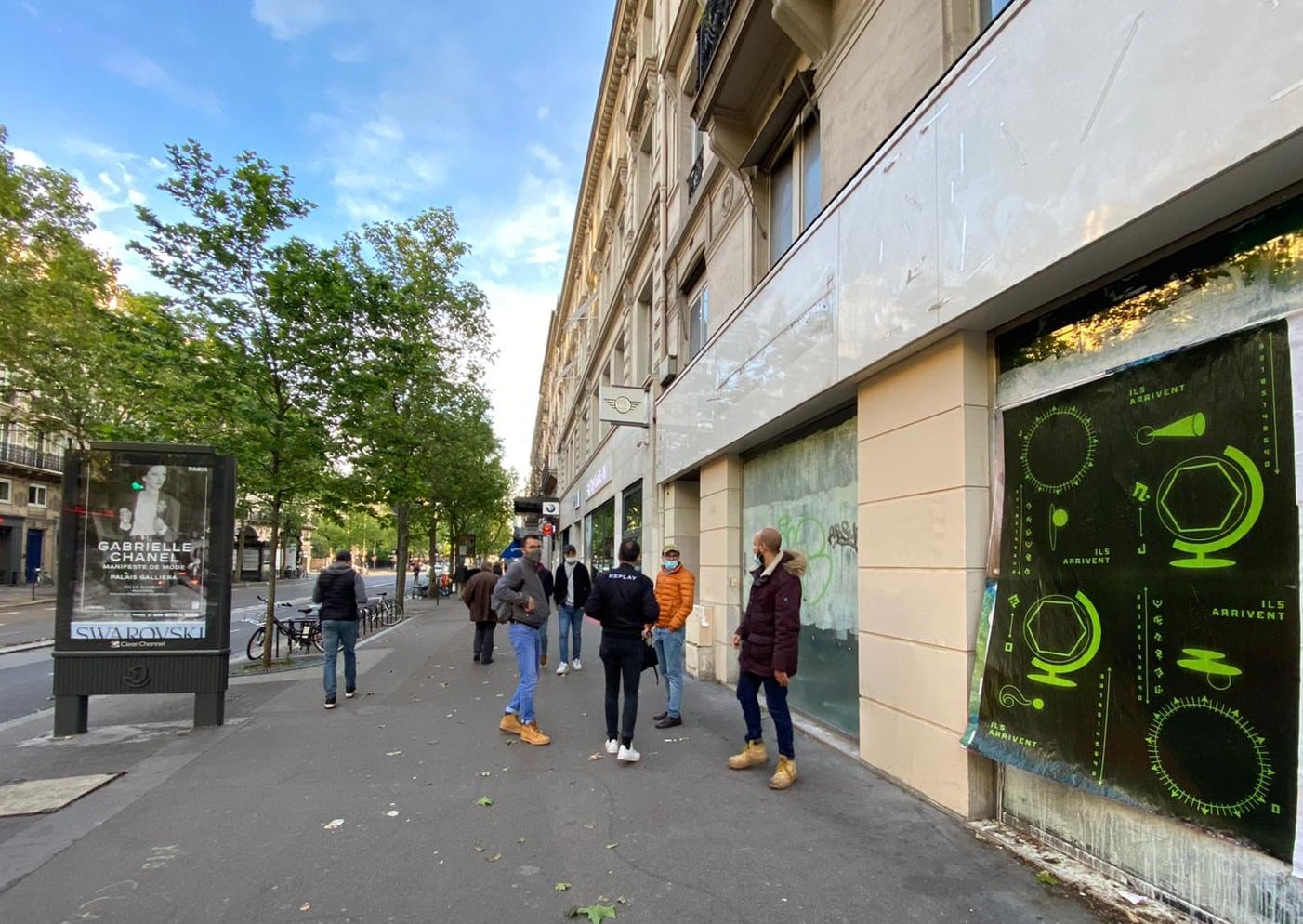Wild Posting® posters installed along Boulevard de Sébastopol in Paris, reaching pedestrians in a high-traffic urban corridor.