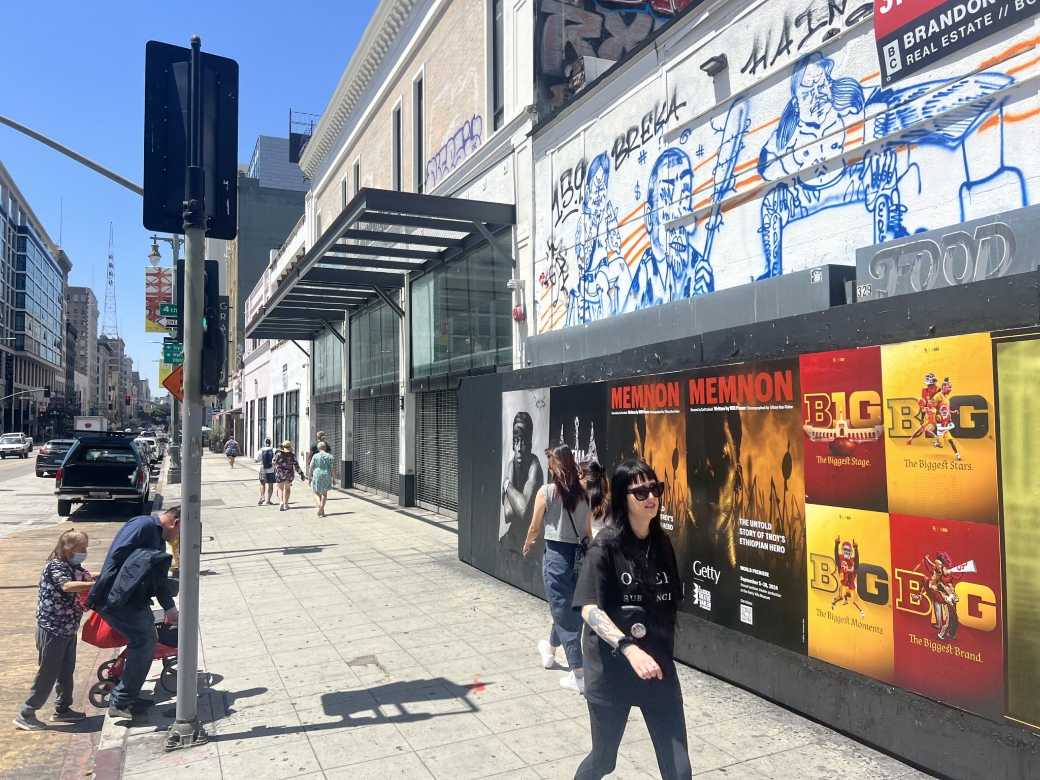 Wild Posting® street advertising installation along South Broadway and West 3rd Street in downtown Los Angeles, featuring layered poster placements in a high pedestrian corridor.